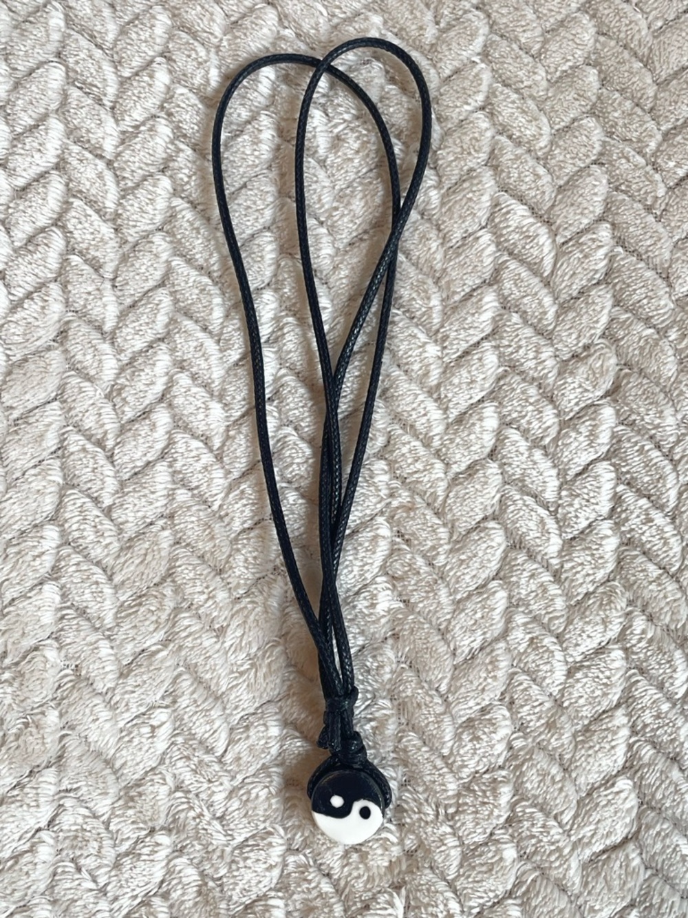 Adjustable black cord necklace with yin yang pendant